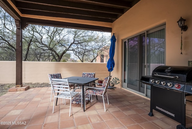 view of patio featuring a grill and outdoor dining space
