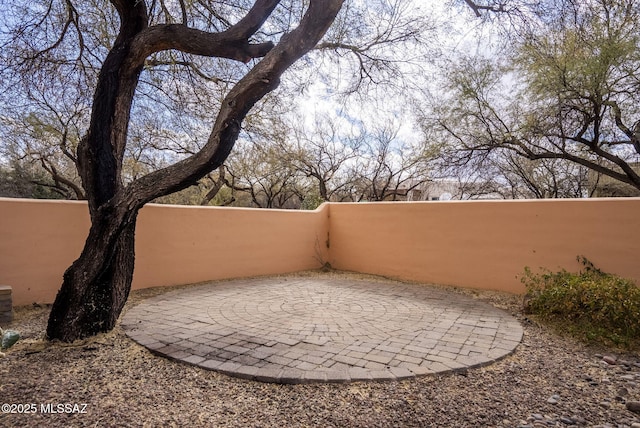 view of patio / terrace featuring fence