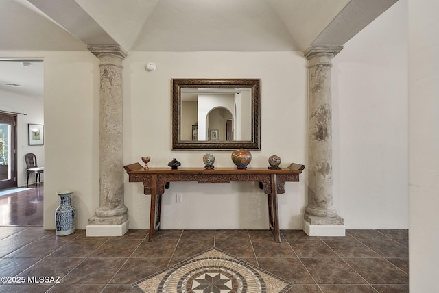 hall featuring ornate columns