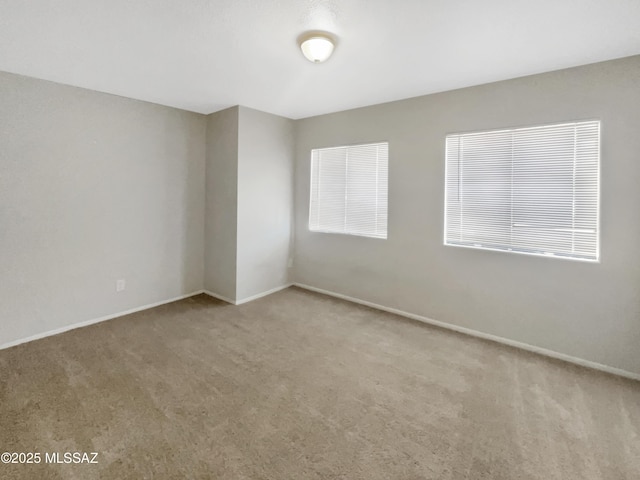 empty room featuring light carpet