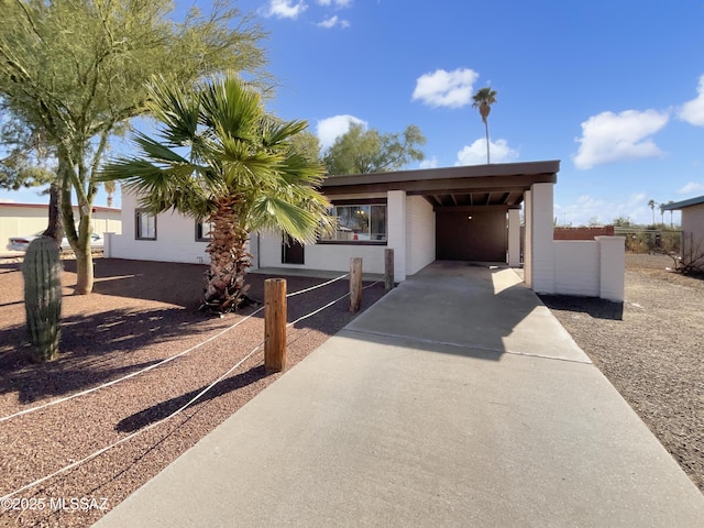 view of front of house featuring a carport