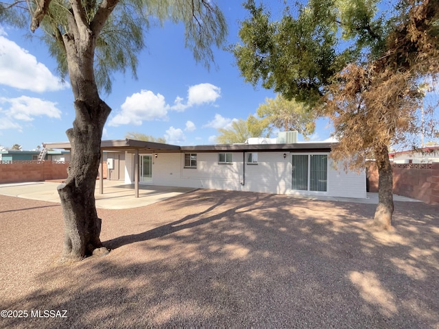 back of property featuring a patio