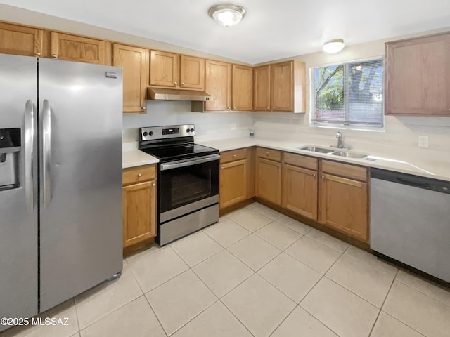 kitchen with tasteful backsplash, sink, light tile patterned floors, and stainless steel appliances