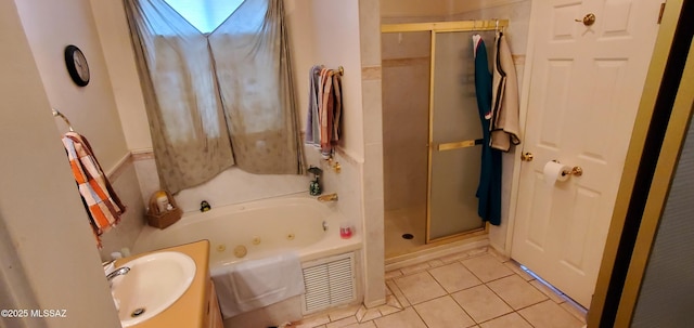 bathroom featuring tile patterned flooring, separate shower and tub, and sink