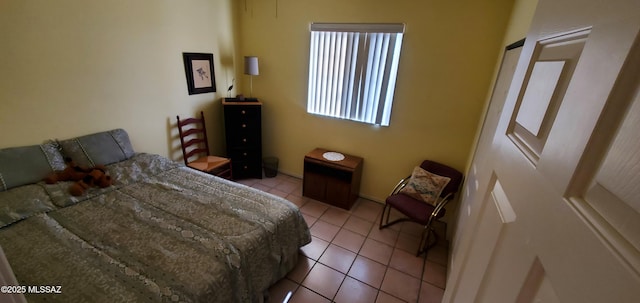 bedroom featuring light tile patterned floors