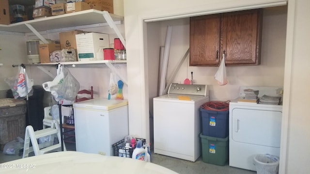 washroom with cabinets and independent washer and dryer