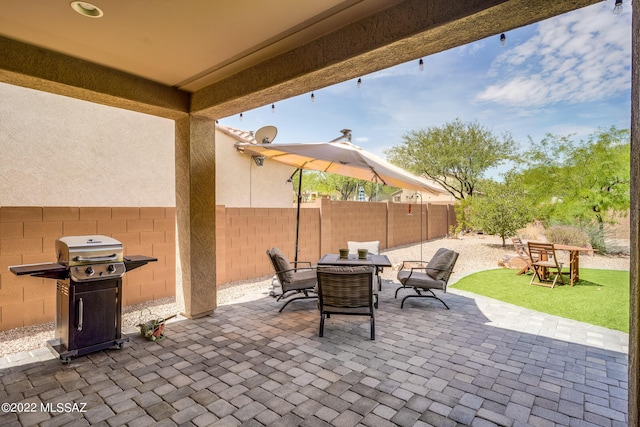 view of patio with a grill