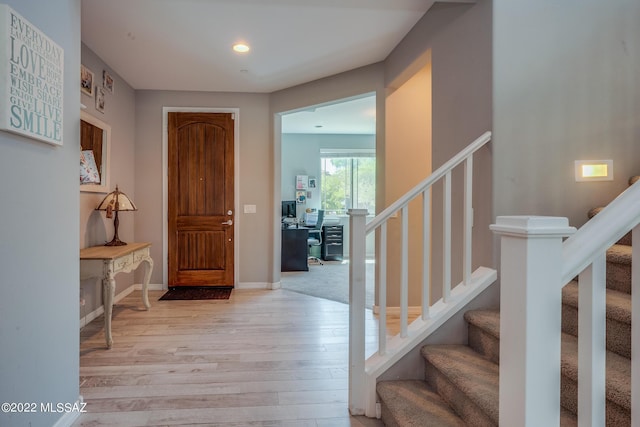 entryway with light hardwood / wood-style floors