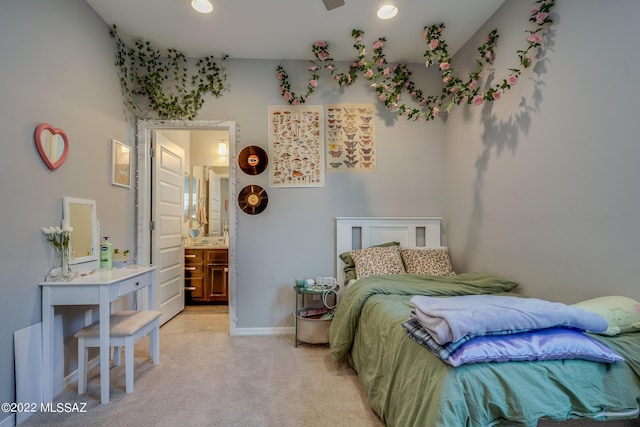 carpeted bedroom with ensuite bathroom