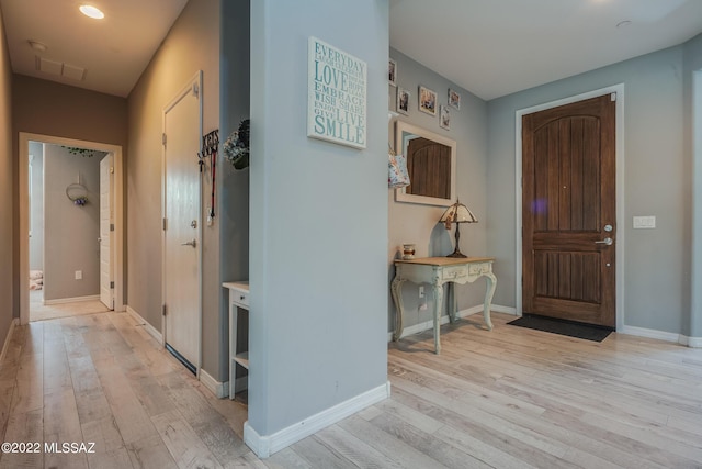 foyer with light hardwood / wood-style floors