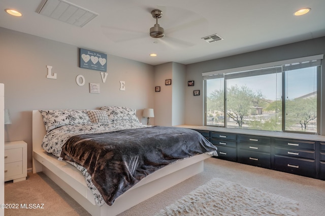 carpeted bedroom with ceiling fan