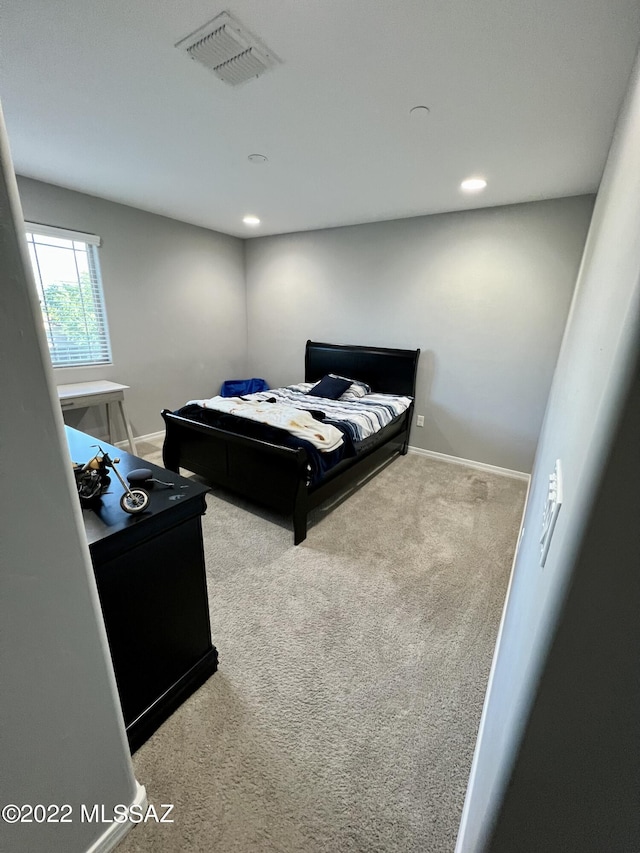 bedroom featuring carpet