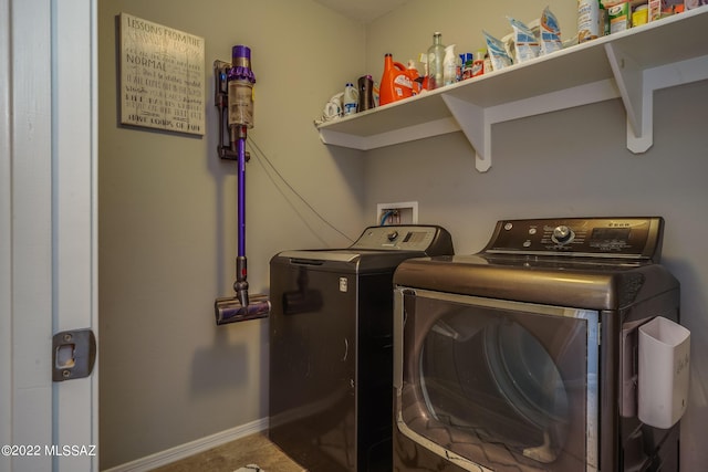 laundry room with washing machine and dryer