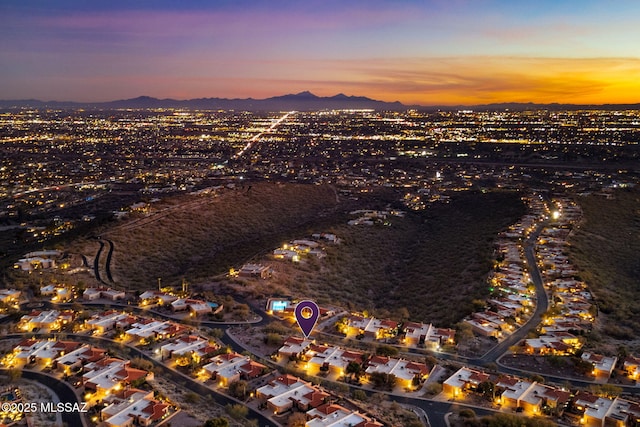 aerial view at dusk with a mountain view