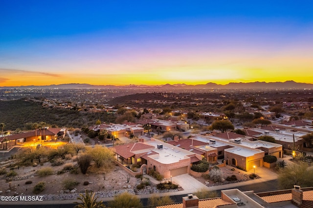 aerial view at dusk with a mountain view