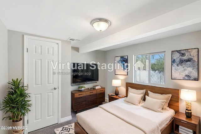 bedroom featuring baseboards, visible vents, and carpet flooring