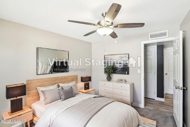 bedroom with baseboards, visible vents, and a ceiling fan