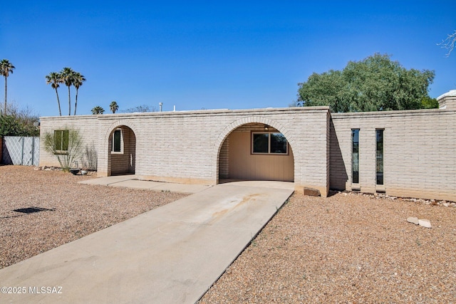 view of front of home featuring fence