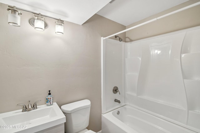 full bathroom with  shower combination, toilet, and a sink