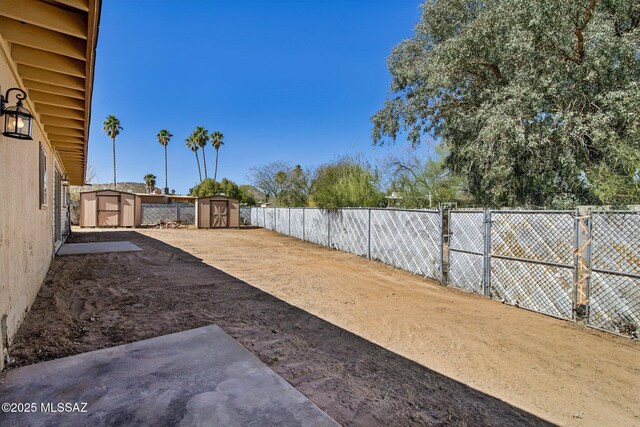 2572 W Calle Genova, Tucson, AZ 85745 - fenced backyard with a storage shed and an outdoor structure