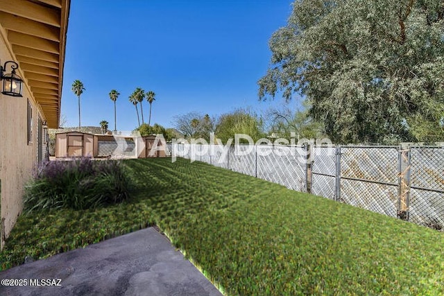 view of yard with a fenced backyard