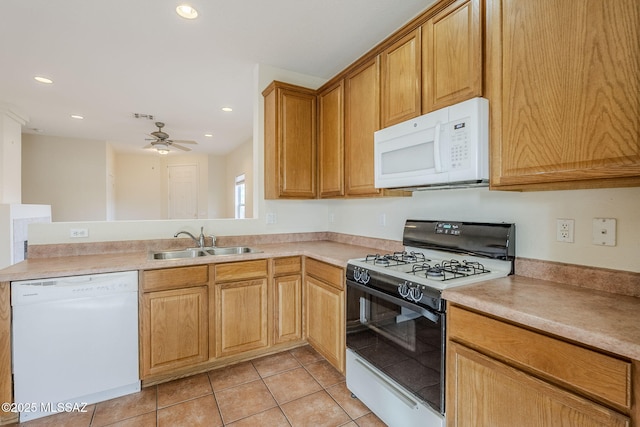 kitchen with sink, light tile patterned floors, ceiling fan, kitchen peninsula, and white appliances