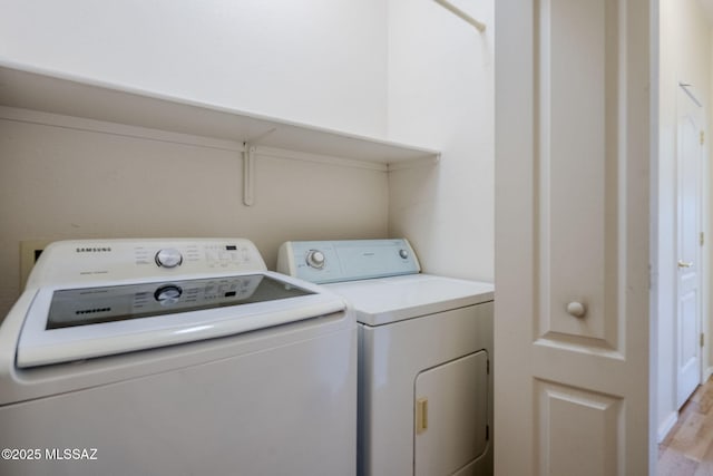 laundry room with washer and clothes dryer