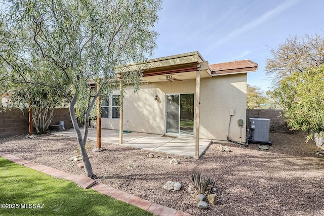 rear view of property featuring central AC, ceiling fan, and a patio