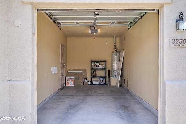 garage featuring a garage door opener and gas water heater