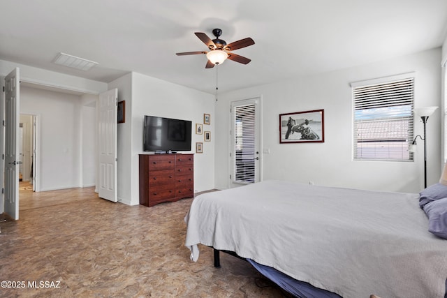 bedroom with visible vents and a ceiling fan