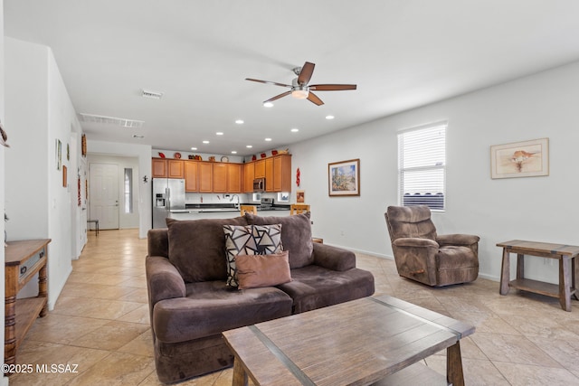 living room featuring ceiling fan, light tile patterned flooring, visible vents, and recessed lighting