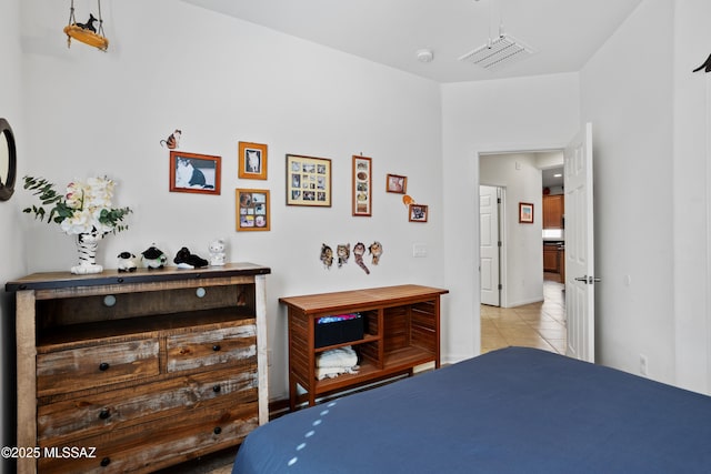 bedroom featuring visible vents and light tile patterned flooring