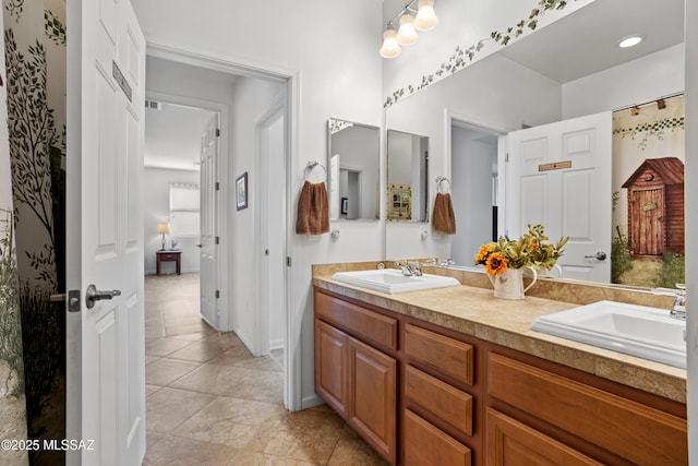 bathroom with a sink and double vanity