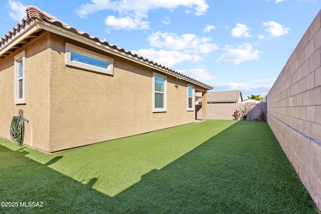 view of yard with a fenced backyard