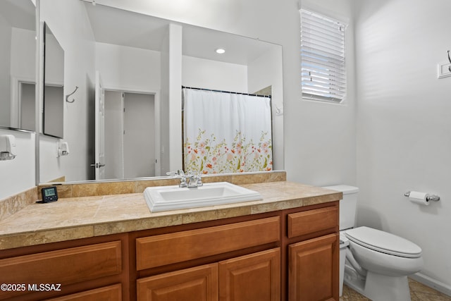 bathroom featuring a shower with shower curtain, vanity, and toilet