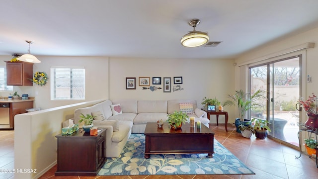 living room with light tile patterned floors