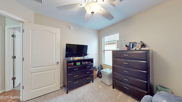 carpeted bedroom with ceiling fan