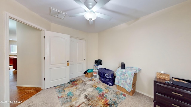 miscellaneous room with light carpet and ceiling fan