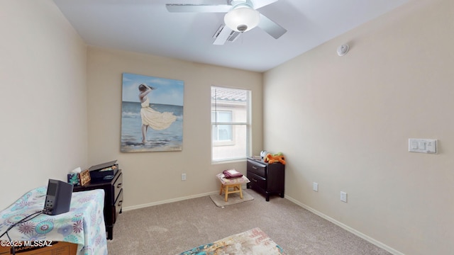 interior space featuring ceiling fan and light colored carpet