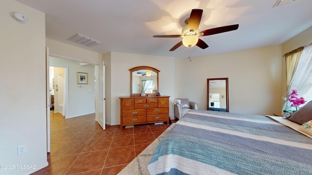 bedroom featuring ceiling fan and dark tile patterned floors