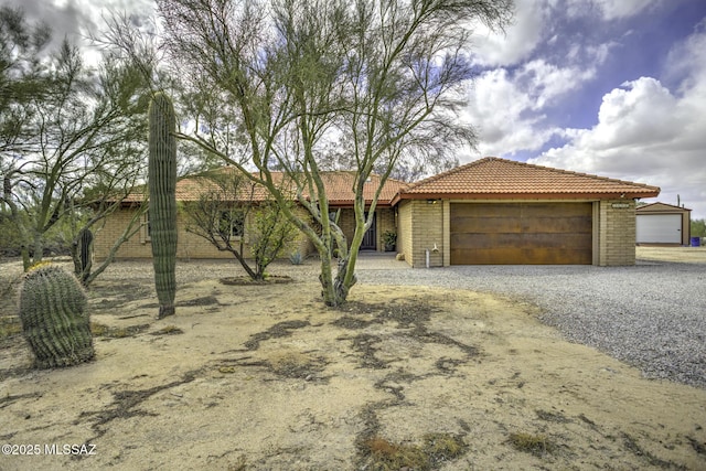 ranch-style house with a tile roof