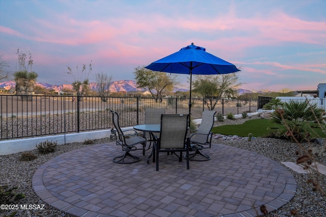 patio terrace at dusk with a mountain view