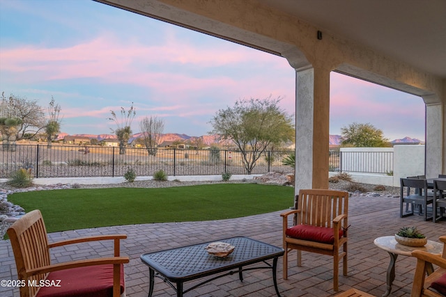 patio terrace at dusk with a yard