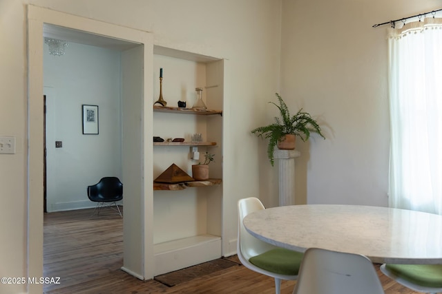 dining area featuring dark hardwood / wood-style floors