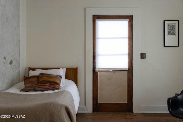 bedroom featuring dark hardwood / wood-style floors