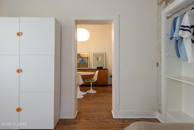 hallway with wood-type flooring