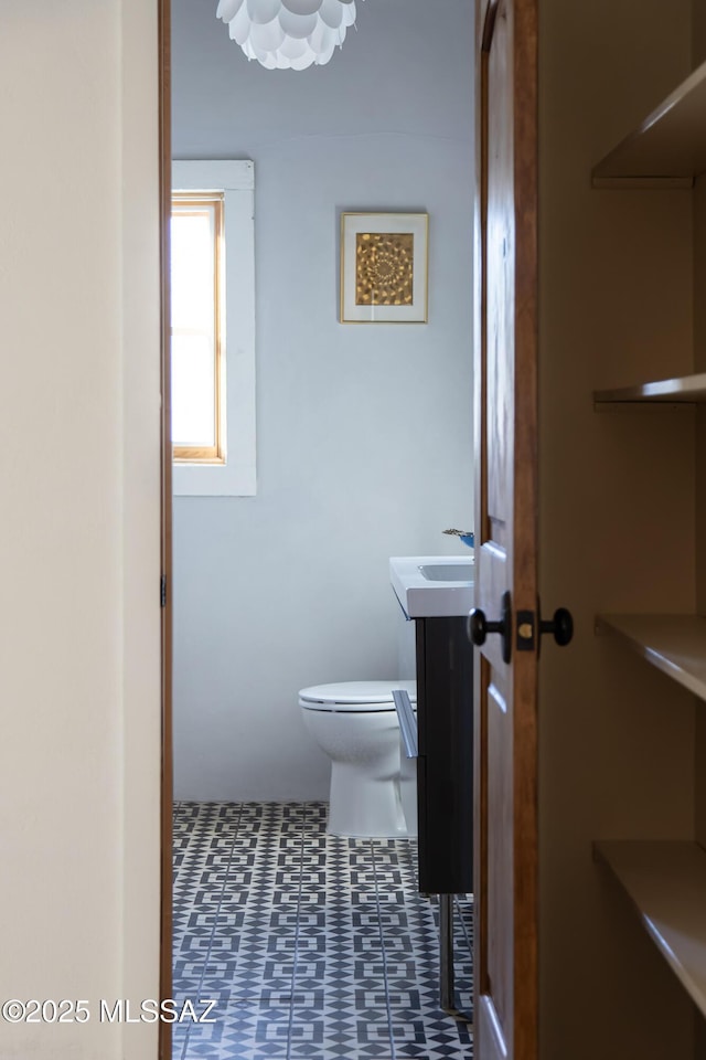 bathroom featuring vanity and toilet