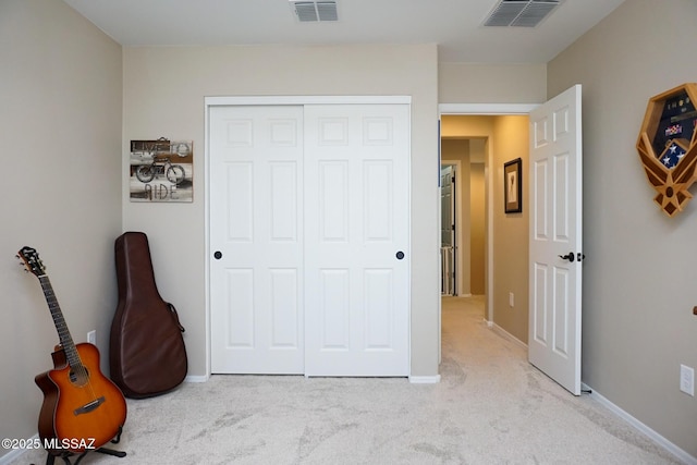 carpeted bedroom with a closet