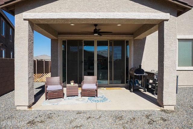 view of patio featuring a grill and ceiling fan