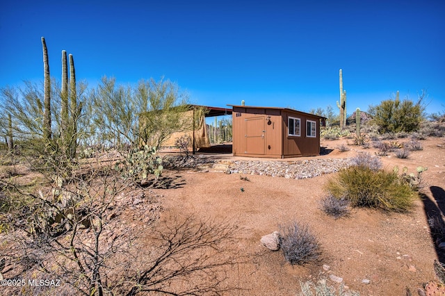 exterior space featuring a shed